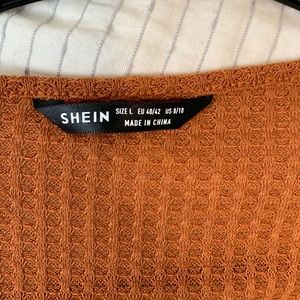 Orange peplum long sleeve top